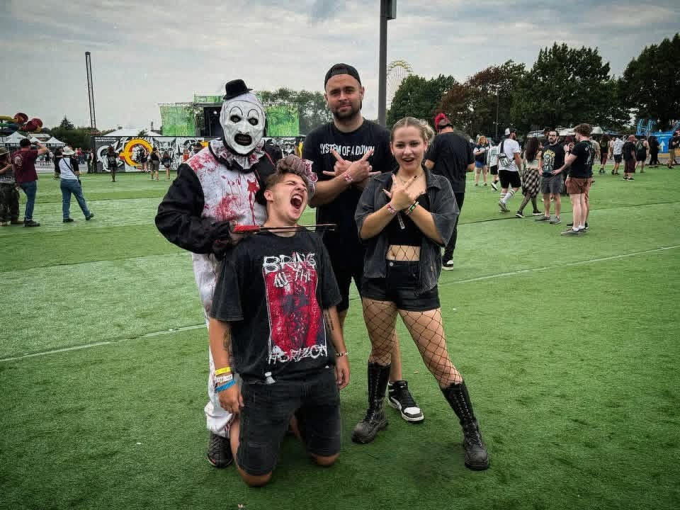 Aleksandr with three friends on the festival field